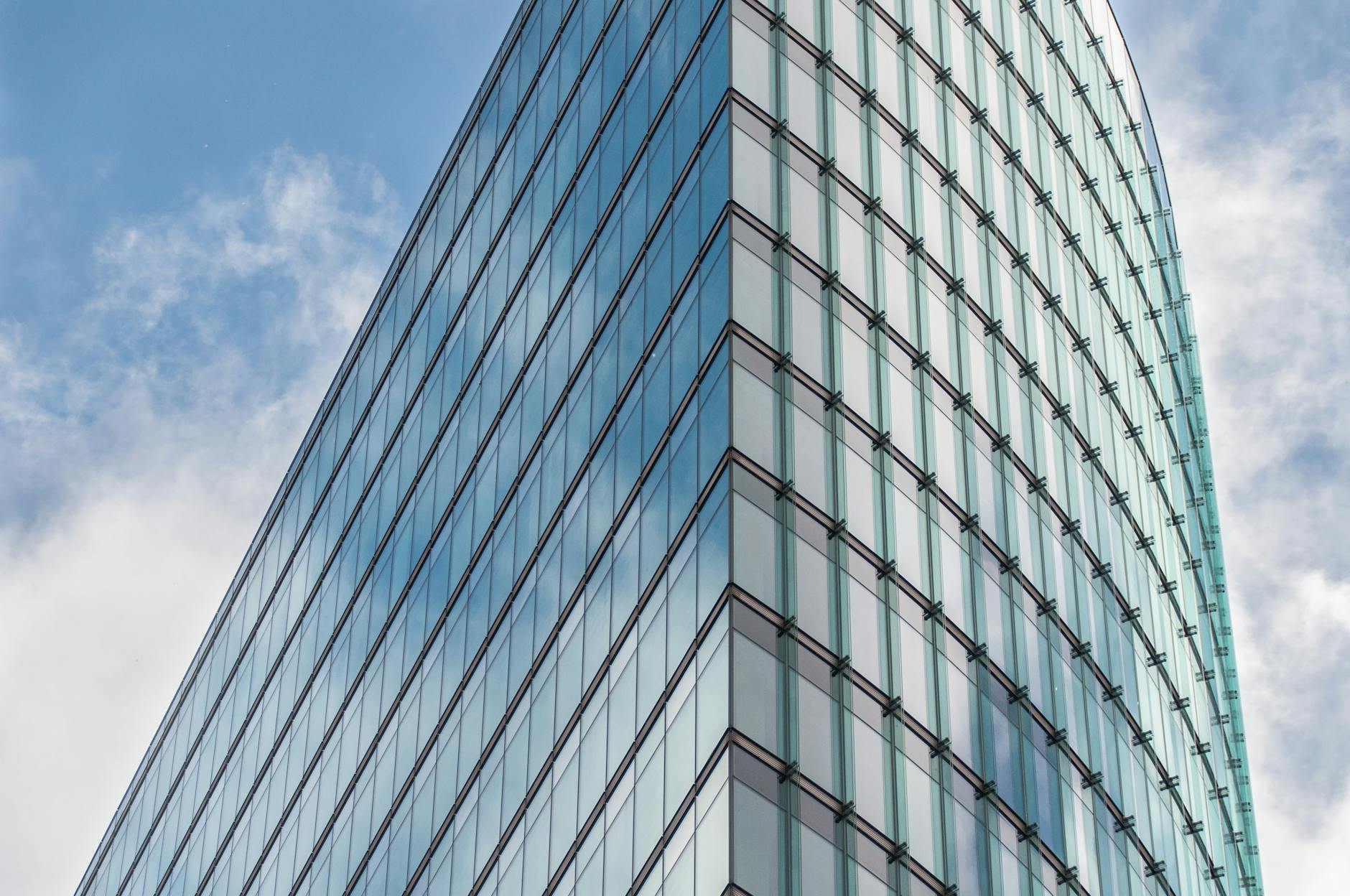 Modern office tower against a dusk sky