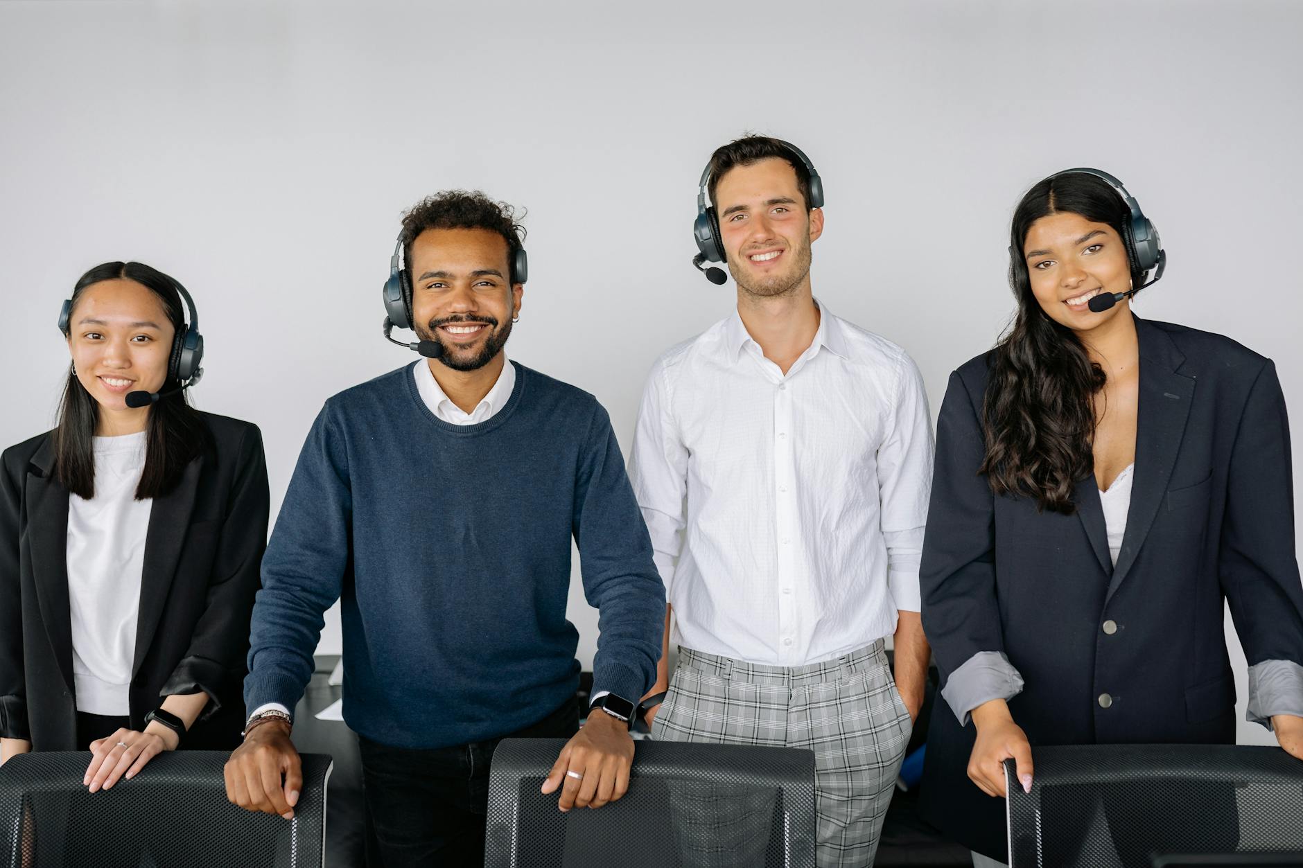 A customer support specialist wearing a headset at a desk
